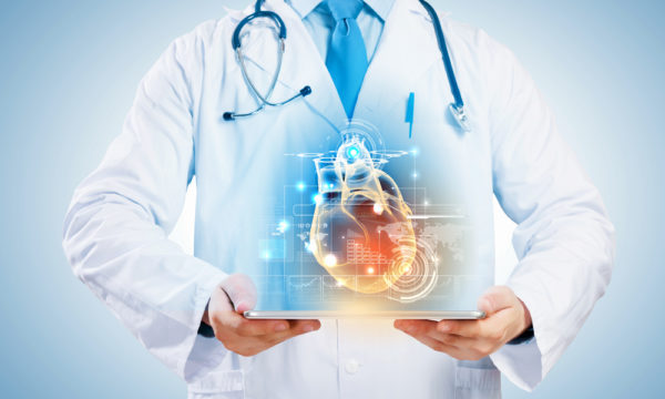Doctor holding a digital heart diagnostic visual