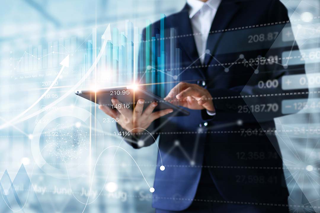 Executive reviewing financial charts on a tablet